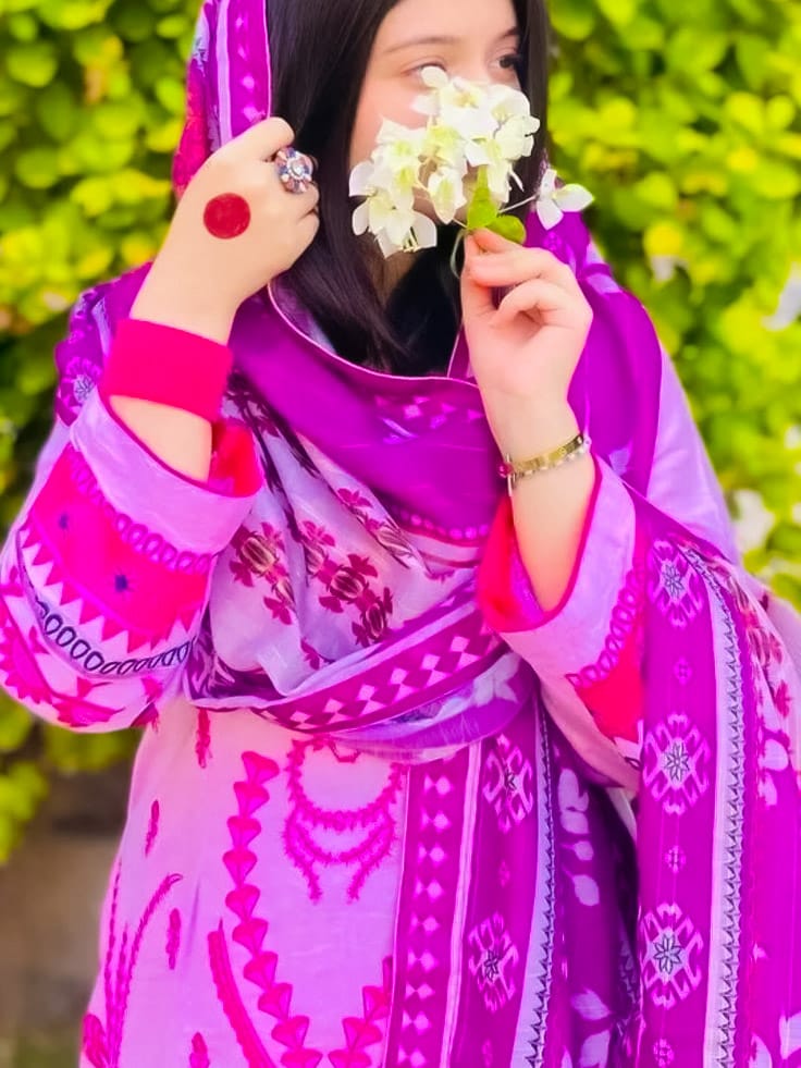 Very beautiful photography of a girl holding flowers in her hands with background natural pick cloth